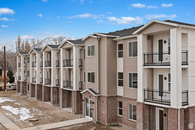 view of building exterior featuring a mountain view