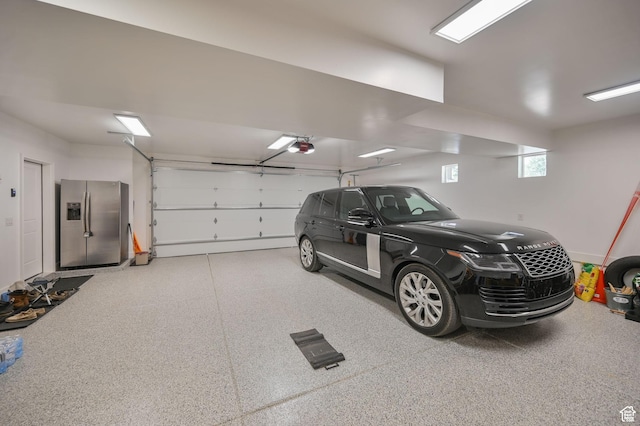 10694 E Cottonwood Ln Unit 539, Heber City, UT 84032 - garage with a garage door opener and stainless steel refrigerator with ice dispenser