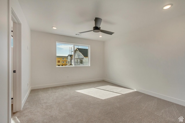 spare room with visible vents, baseboards, ceiling fan, recessed lighting, and light carpet