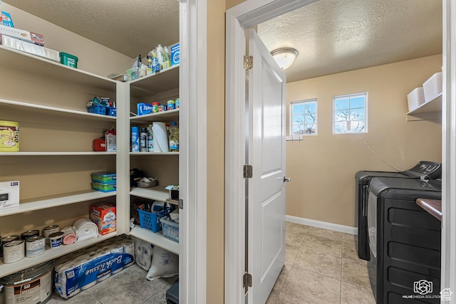 1987 S 2940 E, St George, UT 84790 - laundry area featuring independent washer and dryer, a textured ceiling, and light tile patterned floors