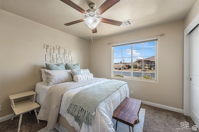 1987 S 2940 E, St George, UT 84790 - bedroom featuring carpet, a closet, ceiling fan, and a textured ceiling