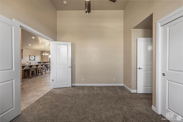 1987 S 2940 E, St George, UT 84790 - carpeted empty room with ceiling fan with notable chandelier