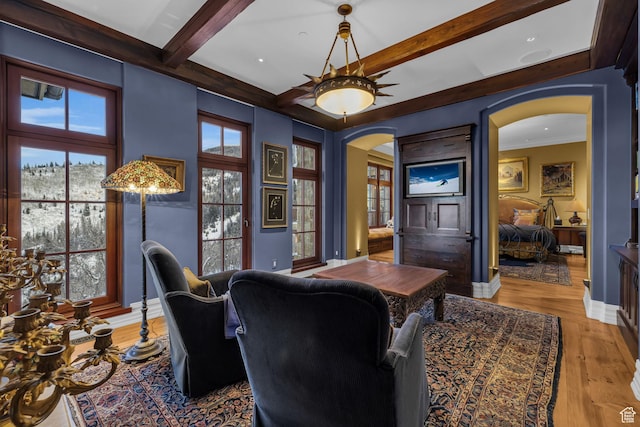 17 White Pine Canyon Rd, Park City, UT 84060 - home office featuring wood finished floors, baseboards, beam ceiling, arched walkways, and ceiling fan