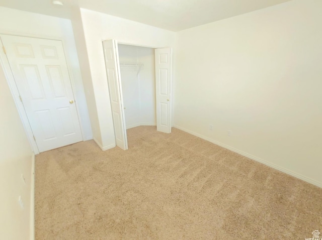 1617 W Treille Ct Unit I12, West Valley City, UT 84119 - unfurnished bedroom featuring light colored carpet and a closet