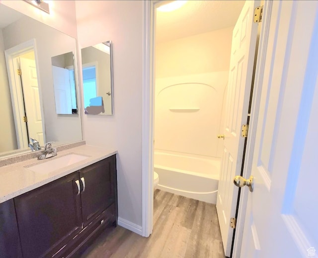 1617 W Treille Ct Unit I12, West Valley City, UT 84119 - full bathroom with shower / bathing tub combination, hardwood / wood-style floors, vanity, and toilet