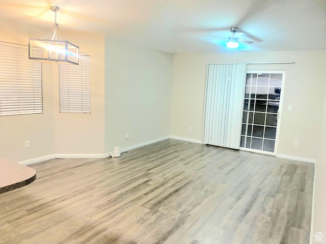 1617 W Treille Ct Unit I12, West Valley City, UT 84119 - spare room featuring ceiling fan and wood-type flooring