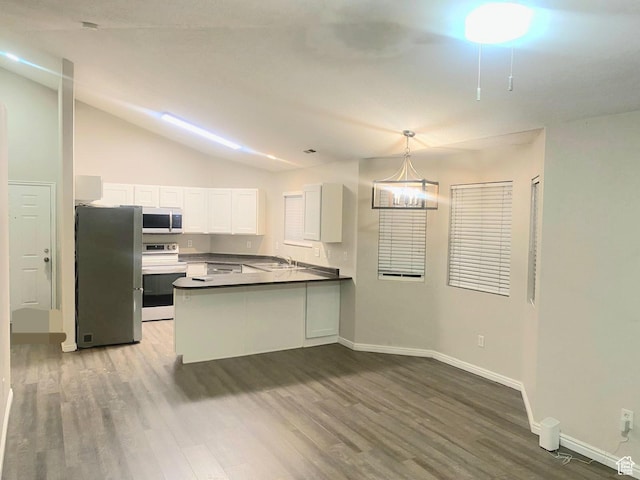 1617 W Treille Ct Unit I12, West Valley City, UT 84119 - kitchen featuring kitchen peninsula, decorative light fixtures, white cabinets, appliances with stainless steel finishes, and sink