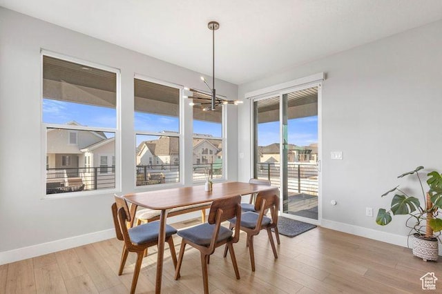 51 N Gray Fox Cir, Kaysville, UT 84037 - dining area with a chandelier and light wood-type flooring