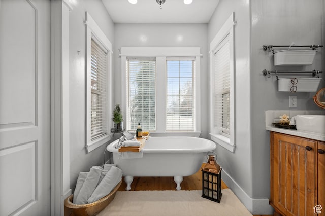 277 W Canyon Crest Rd, Alpine, UT 84004 - bathroom featuring baseboards, a freestanding tub, vanity, and wood finished floors