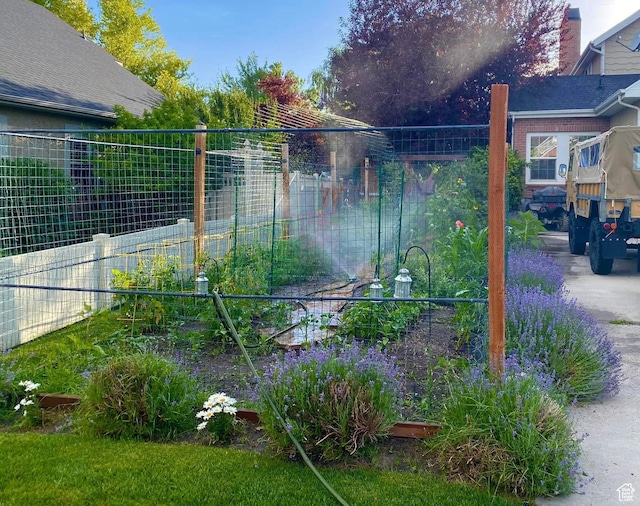 277 W Canyon Crest Rd, Alpine, UT 84004 - view of yard featuring a garden and fence
