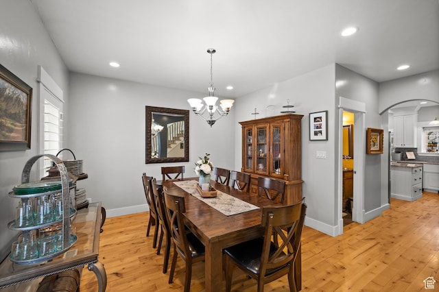277 W Canyon Crest Rd, Alpine, UT 84004 - dining space featuring baseboards, an inviting chandelier, recessed lighting, light wood-style flooring, and arched walkways