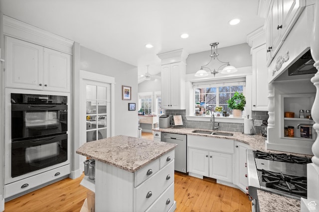 277 W Canyon Crest Rd, Alpine, UT 84004 - kitchen with dobule oven black, dishwasher, a sink, and backsplash