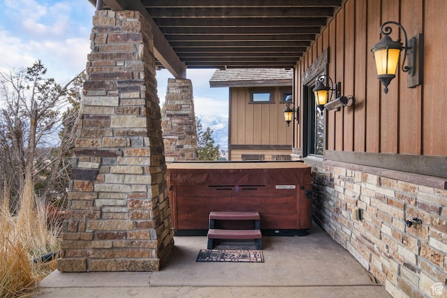 view of patio / terrace with a hot tub