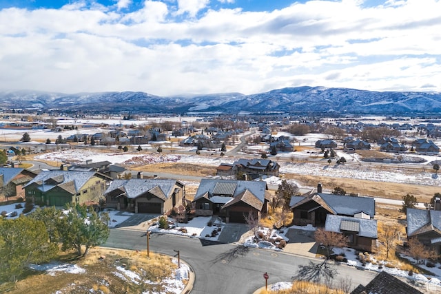 birds eye view of property with a mountain view
