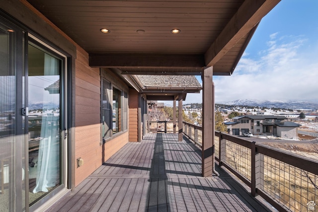 wooden deck with a mountain view
