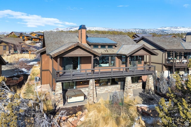 rear view of property with a mountain view