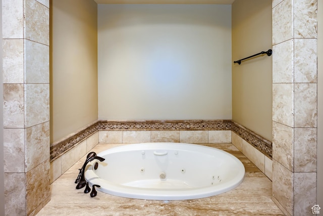 bathroom with tiled tub