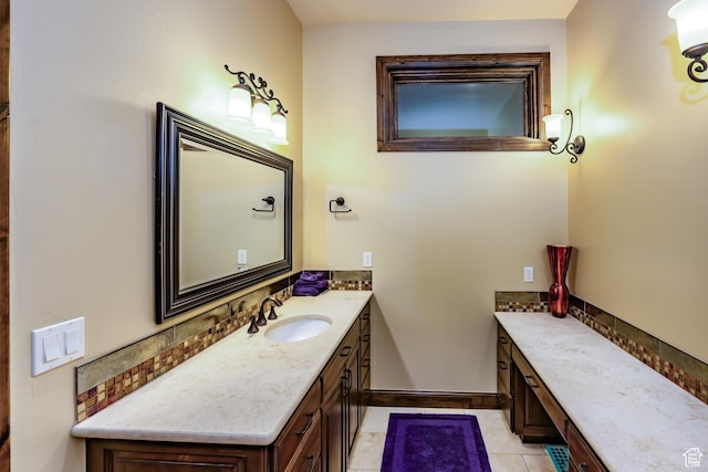 bathroom featuring tile patterned flooring and vanity