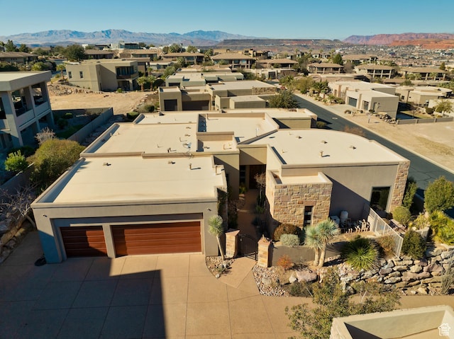 birds eye view of property featuring a mountain view