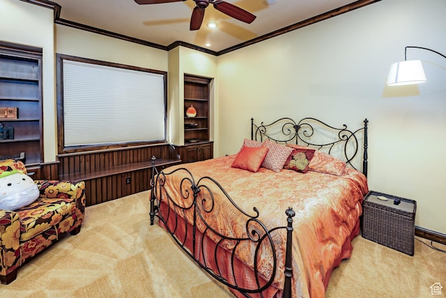 carpeted bedroom with ceiling fan and crown molding