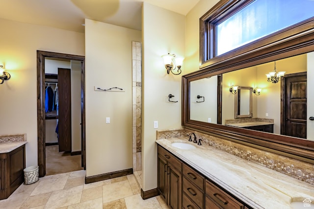 bathroom featuring vanity and an inviting chandelier