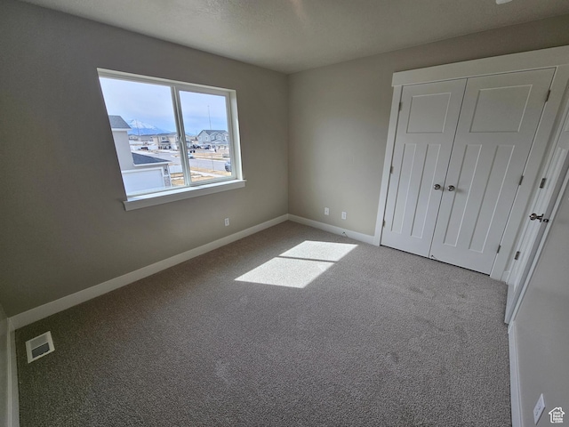 1447 W 500 N Lot 17, Springville, UT 84663 - unfurnished bedroom featuring a closet, visible vents, baseboards, and carpet floors
