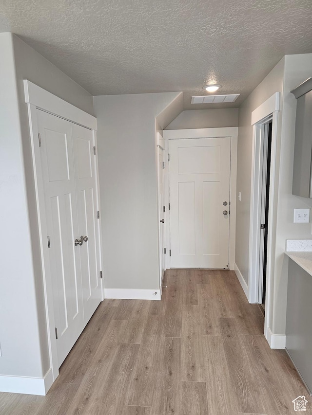1447 W 500 N Lot 17, Springville, UT 84663 - hall featuring visible vents, baseboards, a textured ceiling, and light wood-style flooring