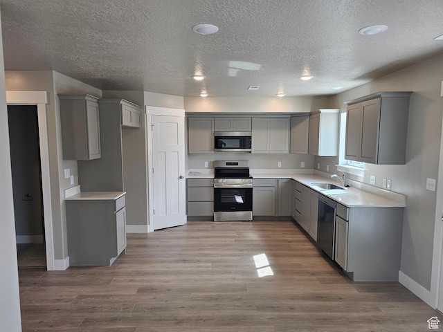 1447 W 500 N Lot 17, Springville, UT 84663 - kitchen with a sink, gray cabinetry, wood finished floors, and appliances with stainless steel finishes