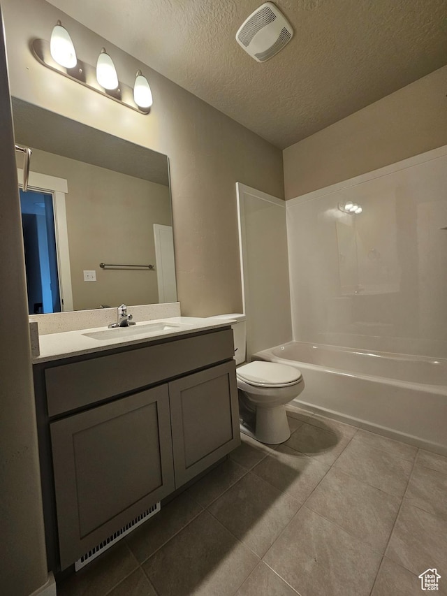 1447 W 500 N Lot 17, Springville, UT 84663 - full bathroom featuring tile patterned floors, visible vents, toilet, a textured ceiling, and vanity