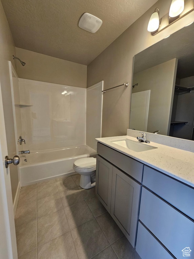 1447 W 500 N Lot 17, Springville, UT 84663 - bathroom featuring toilet, shower / bathtub combination, tile patterned floors, a textured ceiling, and vanity