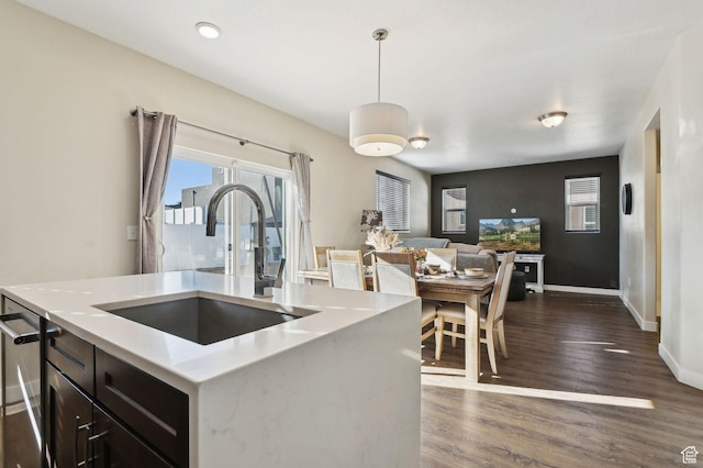 6343 W 7900 S, West Jordan, UT 84081 - kitchen with dishwasher, decorative light fixtures, dark wood-type flooring, sink, and a kitchen island with sink