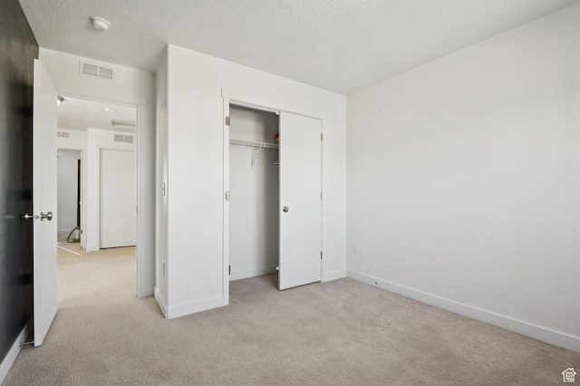 6343 W 7900 S, West Jordan, UT 84081 - unfurnished bedroom featuring light carpet, a closet, and a textured ceiling