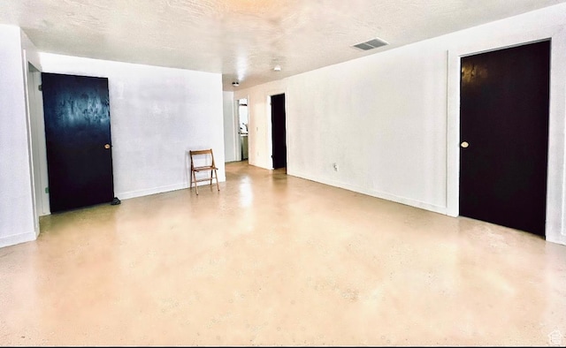 19600 N 8250 E, Mount Pleasant, UT 84647 - unfurnished room featuring visible vents, a textured ceiling, baseboards, and finished concrete floors