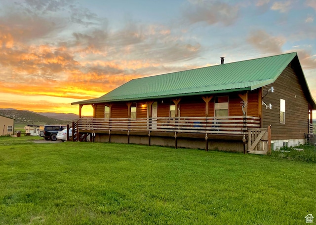19600 N 8250 E, Mount Pleasant, UT 84647 - exterior space featuring a porch, a lawn, metal roof, crawl space, and a mountain view