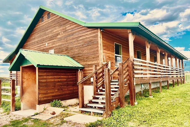 19600 N 8250 E, Mount Pleasant, UT 84647 - view of side of home featuring a porch, metal roof, and stairs