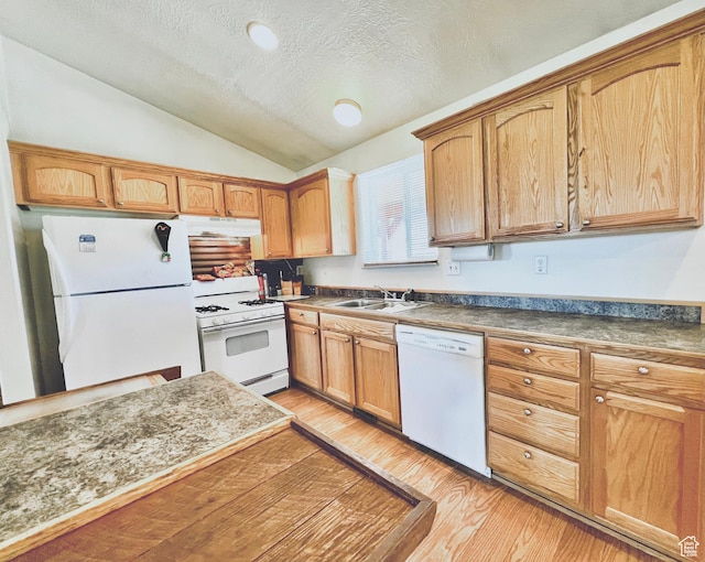 19600 N 8250 E, Mount Pleasant, UT 84647 - kitchen with a sink, under cabinet range hood, white appliances, light wood-style floors, and vaulted ceiling