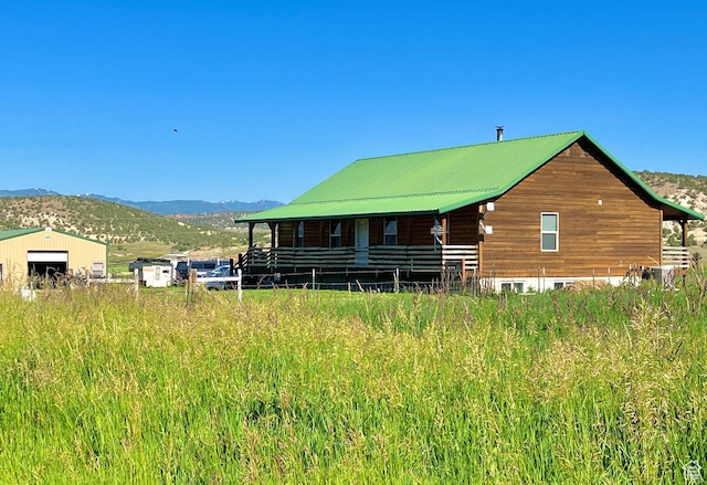 19600 N 8250 E, Mount Pleasant, UT 84647 - exterior space featuring a mountain view, a detached garage, and metal roof