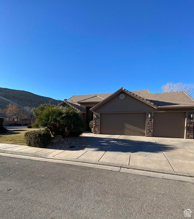 1918 S Mojave Dr, Washington, UT 84780 - view of front of property featuring a mountain view and a garage