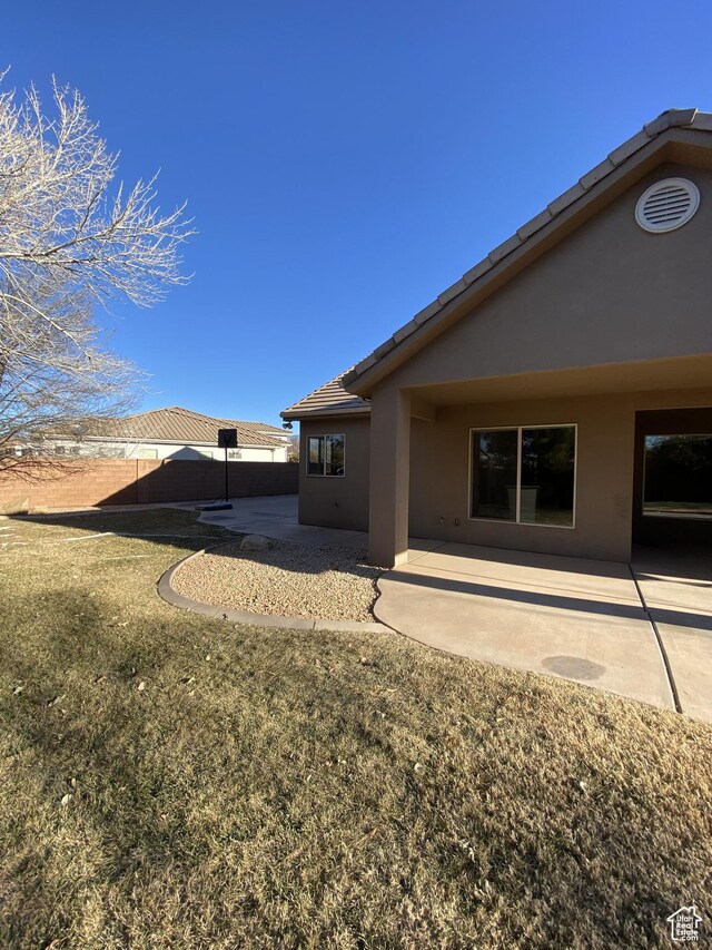 1918 S Mojave Dr, Washington, UT 84780 - rear view of house featuring a patio area and a lawn