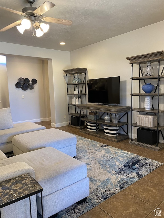 1918 S Mojave Dr, Washington, UT 84780 - living room with ceiling fan and dark tile patterned flooring