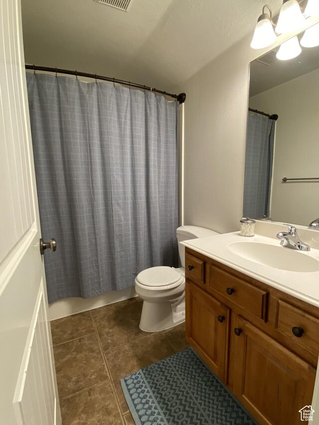 1918 S Mojave Dr, Washington, UT 84780 - bathroom with toilet, tile patterned flooring, a shower with curtain, and vanity
