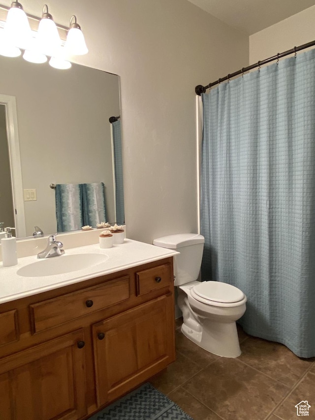 1918 S Mojave Dr, Washington, UT 84780 - bathroom with toilet, tile patterned flooring, vanity, and curtained shower