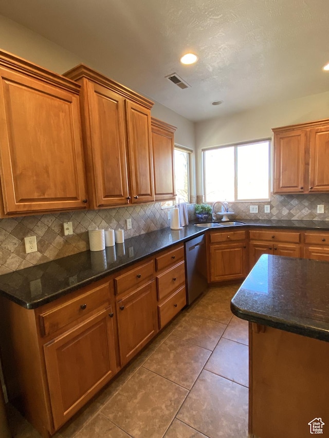 1918 S Mojave Dr, Washington, UT 84780 - kitchen featuring sink, tile patterned floors, dishwasher, and dark stone counters