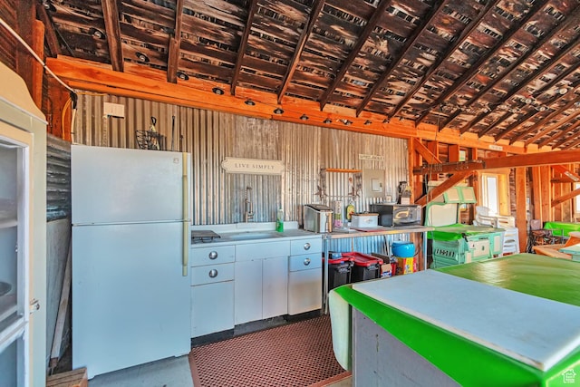 320 S 800 W, Lewiston, UT 84320 - kitchen with vaulted ceiling, a sink, and freestanding refrigerator