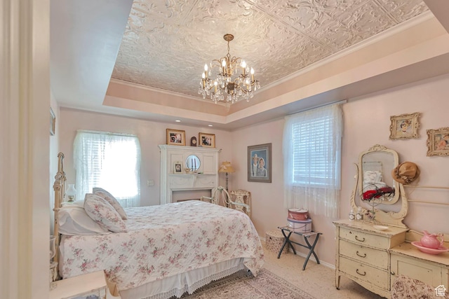 320 S 800 W, Lewiston, UT 84320 - carpeted bedroom with baseboards, a tray ceiling, a chandelier, and ornamental molding