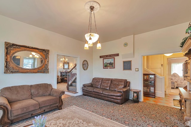 320 S 800 W, Lewiston, UT 84320 - living area featuring stairway, tile patterned flooring, and an inviting chandelier