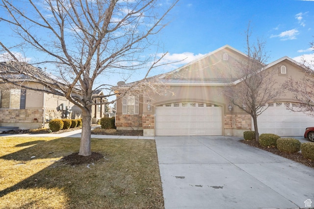 view of front of property featuring a garage and a front yard