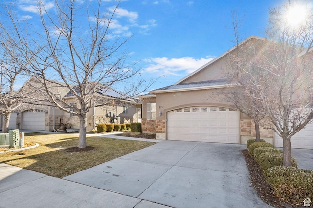 view of front of house featuring a front yard and a garage