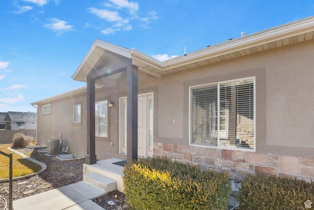 entrance to property featuring central AC