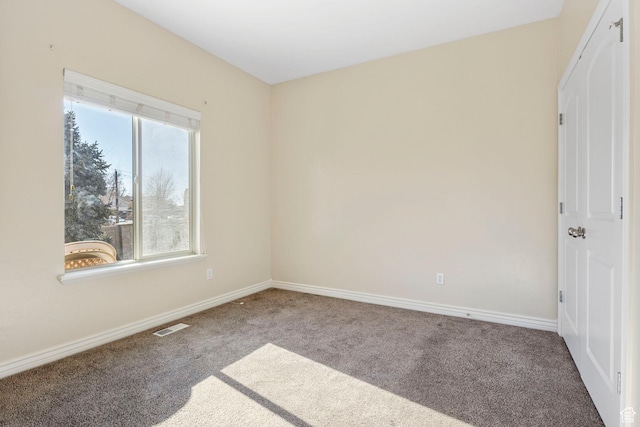 spare room featuring carpet